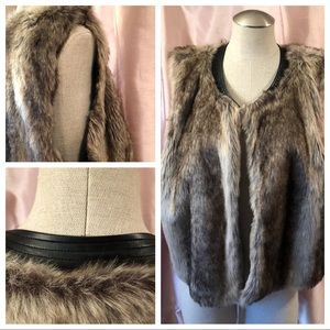 Faux Fur leather trimmed vest.